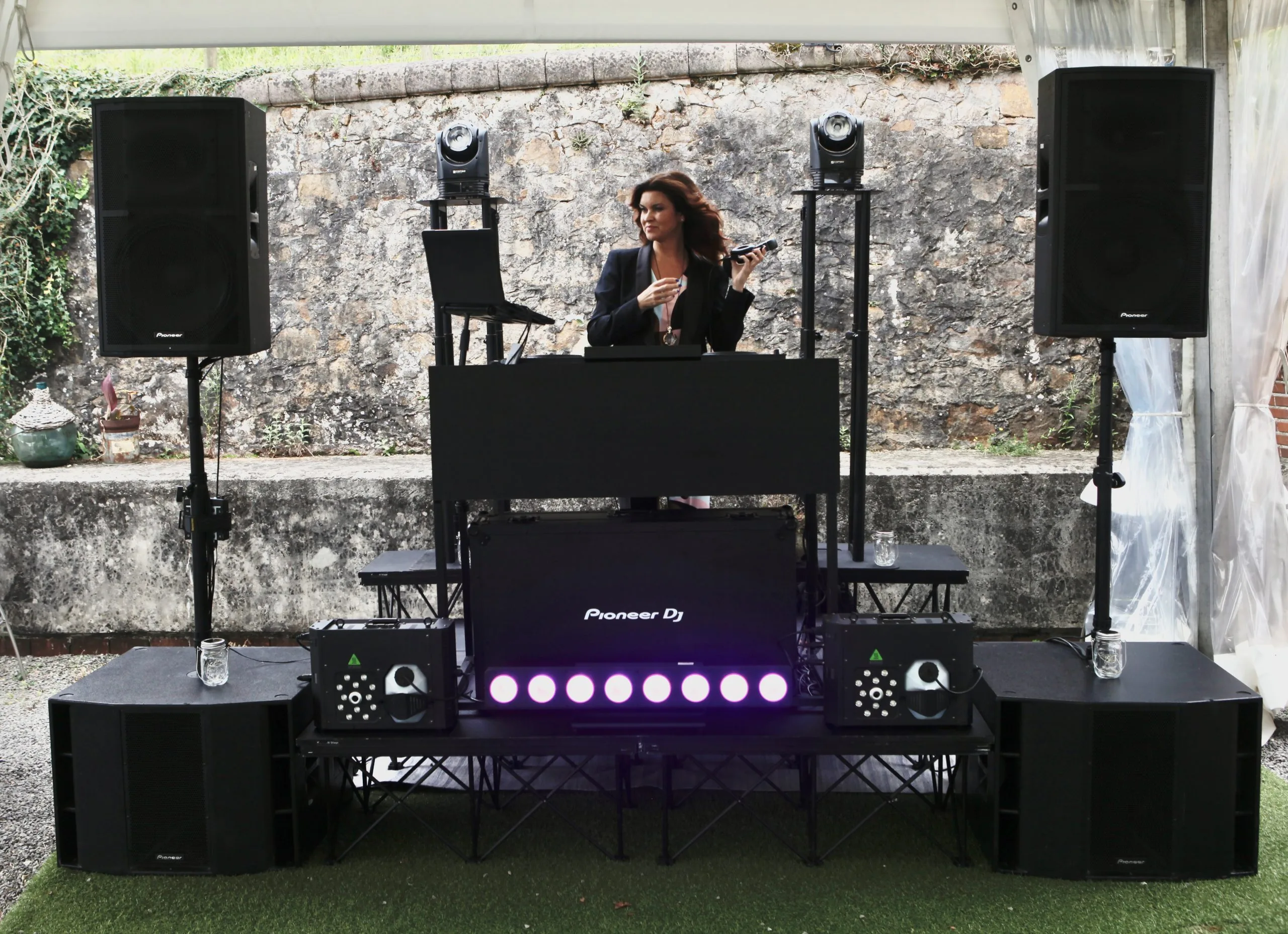 María Martín behind Pioneer DJ — corporate event